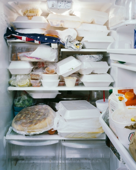 Image of a fridge packed with takeout boxes